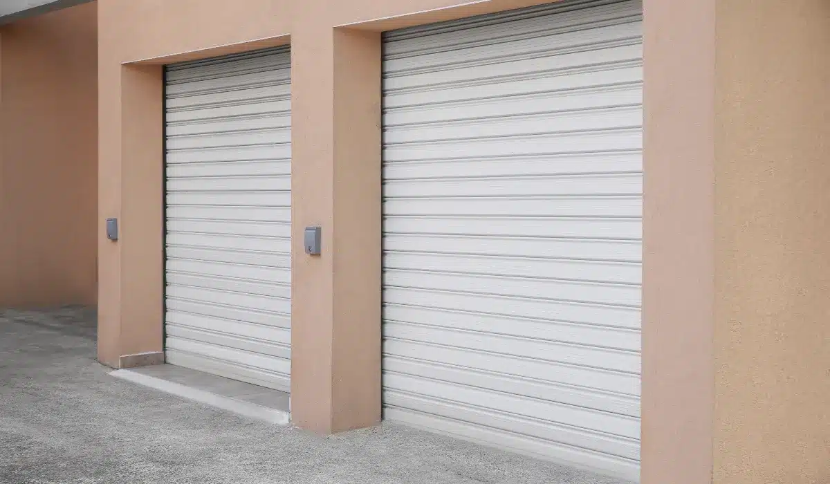 Building with White Roller Shutter Garage Doors