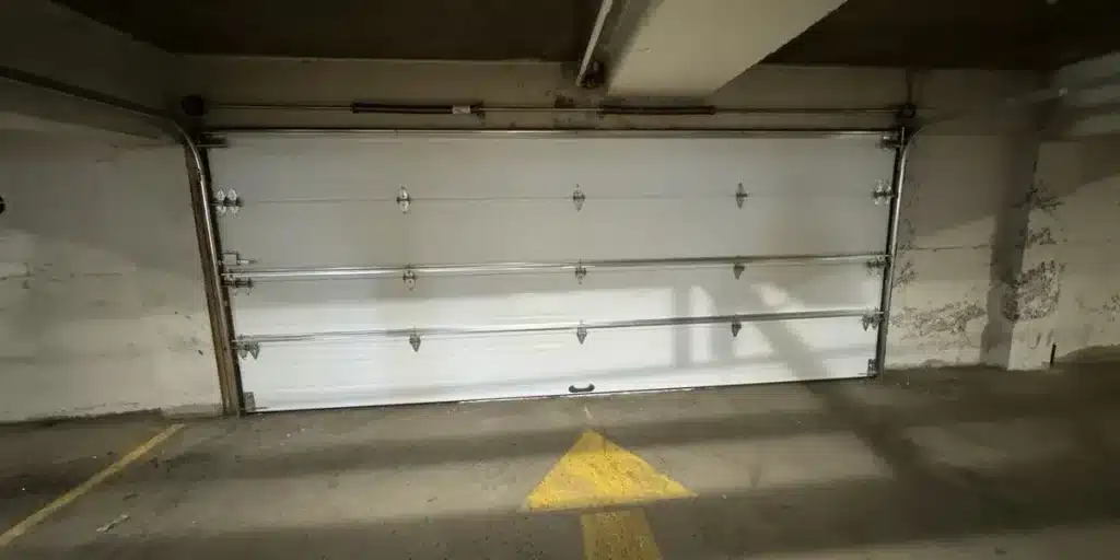 an insulated garage door installed in Laval commercial properties