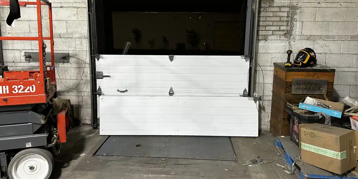 a garage door panels are being installed in a commercial building