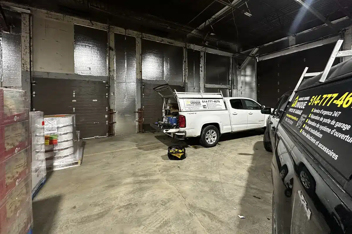 Unique Garage Door Technicians Maintaining a garage door in Blainville