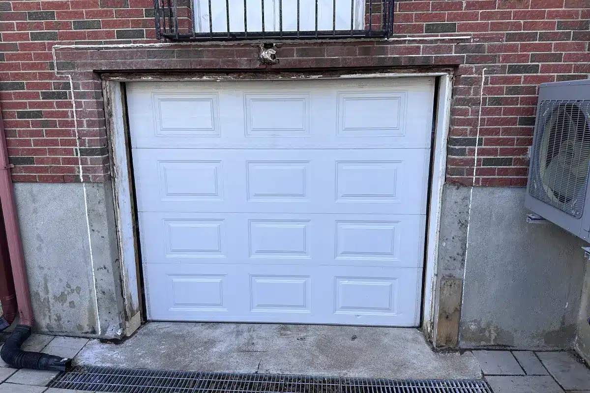 a newly installed manual garage door in Montreal residence