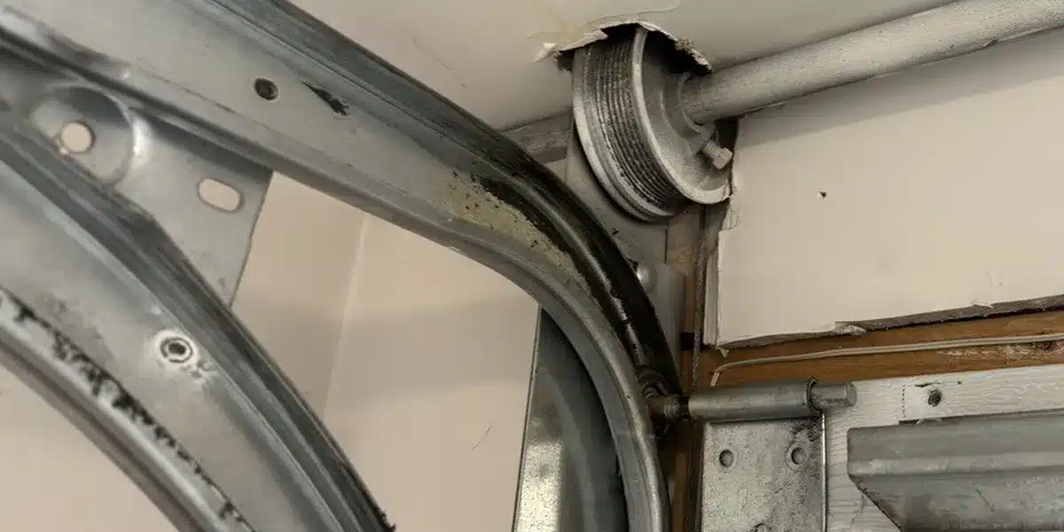 Fixing and aligning a rail in residential garage door in Montreal