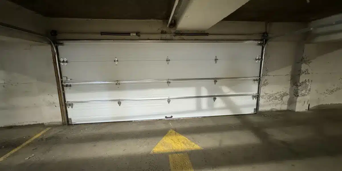 a new insulated garage door installed in a commercial building in Terrebonne